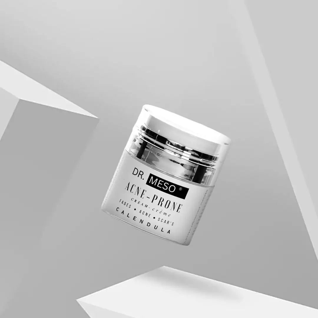 Multiple jars of cream formulated for acne-prone skin.