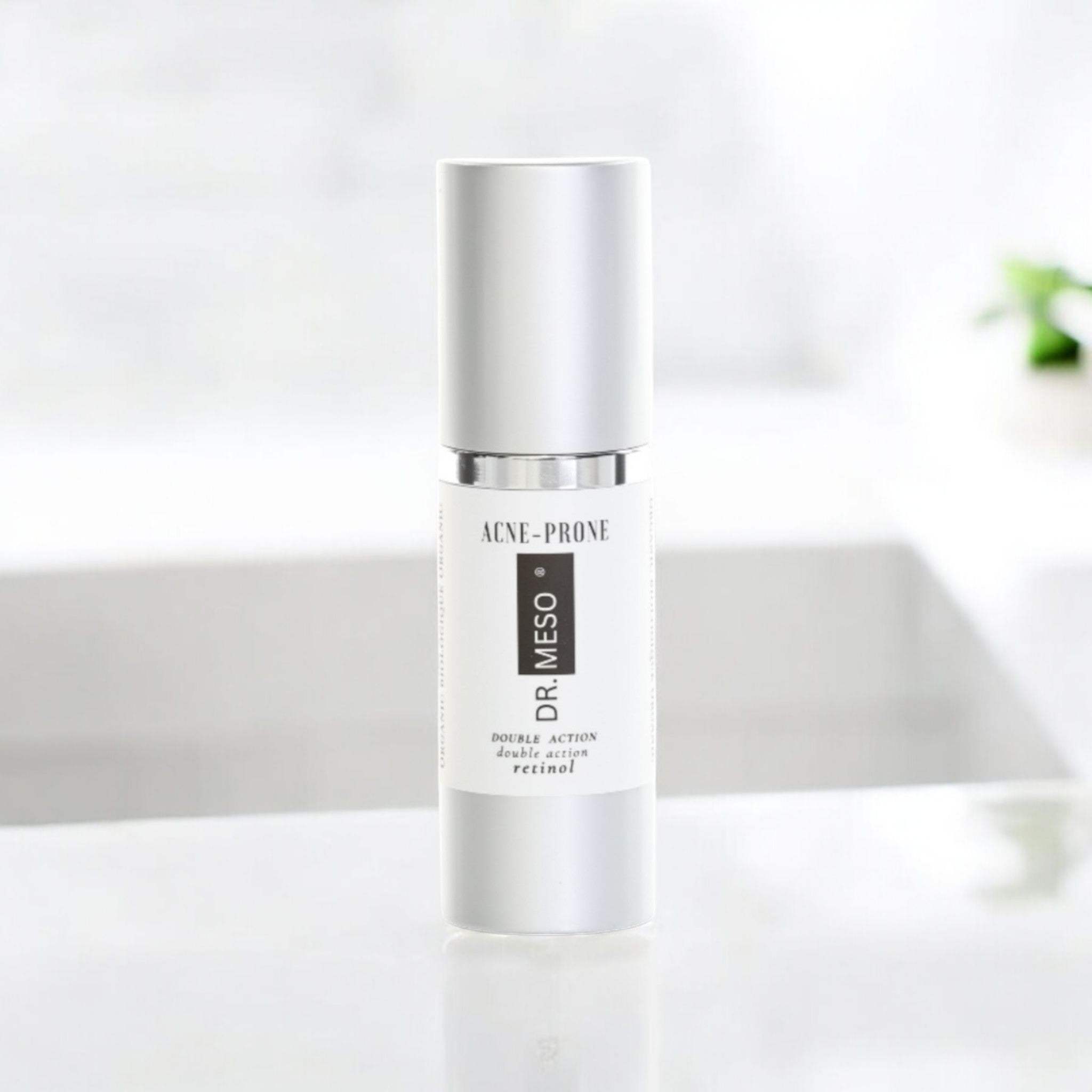 Dropper bottle of retinol serum for acne-prone skin.